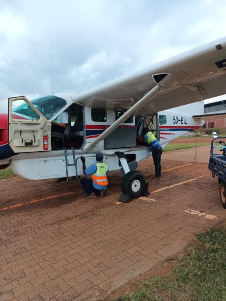 5X-BIL undertgoing final preflight inspection at Kajjanssi airport, Uganda