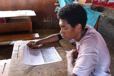 Greg Ruruk in class doing school work.