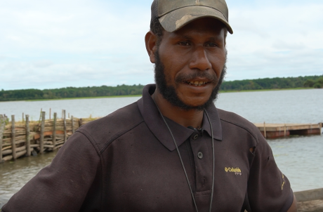 Jerom Bariga in front of a Docking Station being interviewed