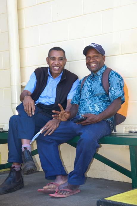 Pastor Robert Hane and Caine Ruruk smiling for the camera.