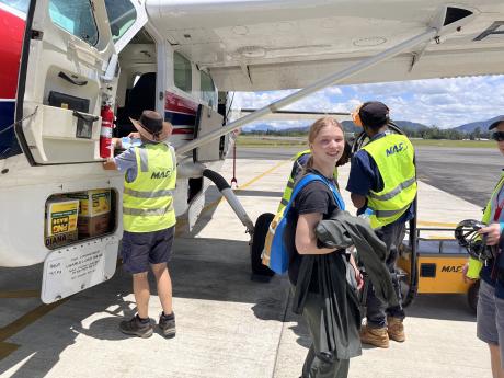 Stephanie in front of MAF plane before departure from Mount Hagen