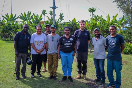 Doctors proudly pose for a photo after successfully installing an HF radio system during their practical session.