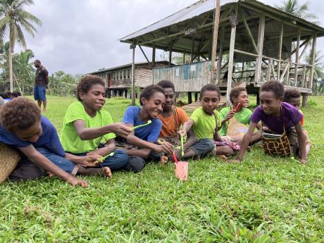 Happy kids with oral health kits