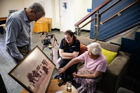 Elderly lady visiting office lobby