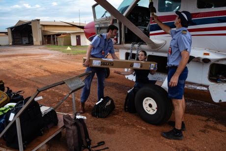 MAF staff loading and preparing plane for day's flying