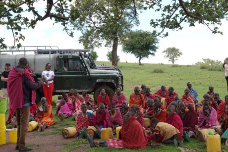 Women being shown how to use the water filters