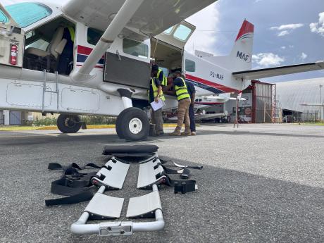 MAF medevac stretcher in front of MAF plane