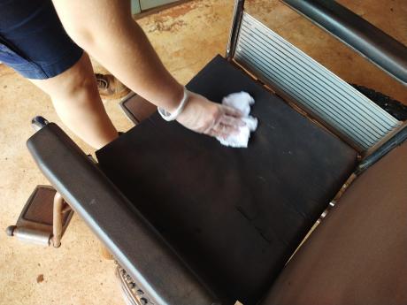 Reservations officer cleaning wheelchair