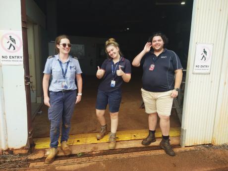 MAF staff in hangar doorway