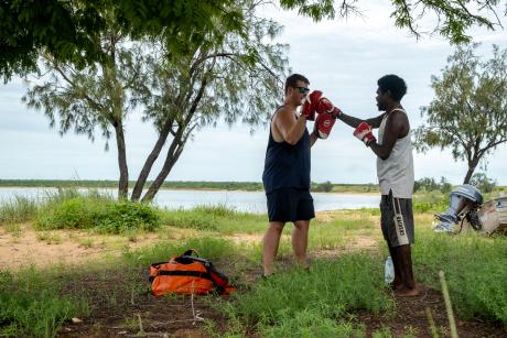 Physiotherapist and patient conducting open-air exercise routine 