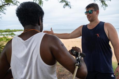 Physiotherapist and patient boxercising outdoors