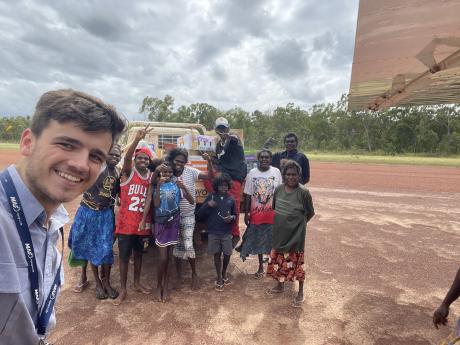 MAF pilot and homeland residents with emergency food supplies