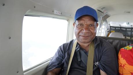 Mr Mekat Mathias sitting in the aircraft