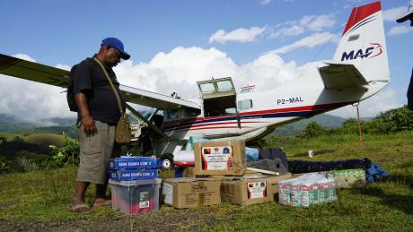 Mr Mekat Mathias checking his cargo after unloading at Sisamin