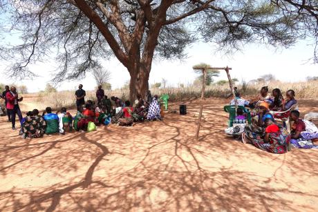 People listening to the preaching during the outreach