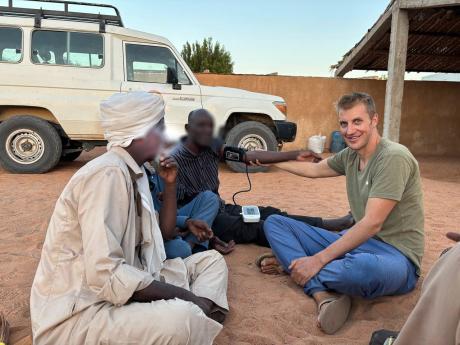 Dr. Luke checking patients' pressure