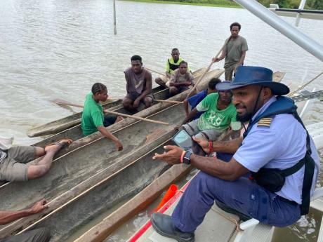 Joseph Tua conversing with the local community members