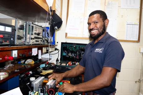 Technician Noah Siso makes repairs in the MAF Technologies radio workshop in Goroka. Many health services, churches and communities rely on MAF Technologies to provide technical support and repairs for their communication equipment.