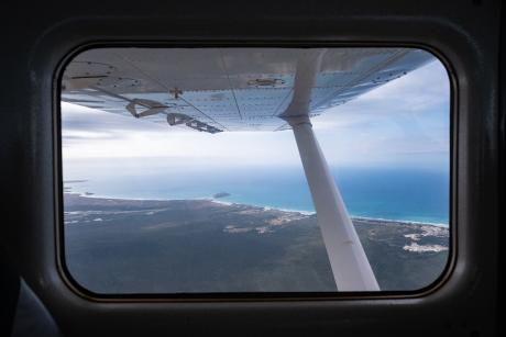 Aerial shot of Arnhem Land coastal scenery through plane windoe