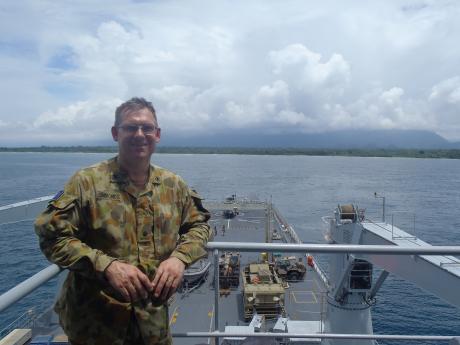 Soldier in uniform on ship deck