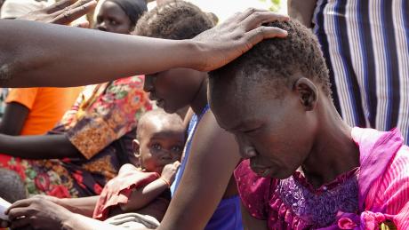 A patient receives prayer 