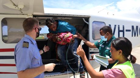 Pilot and medevac patietns diembarking aircraft