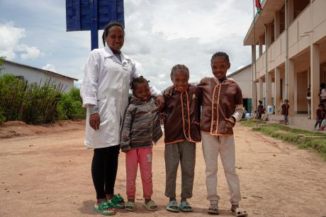 Primary school director in Fiheferana with 3 students