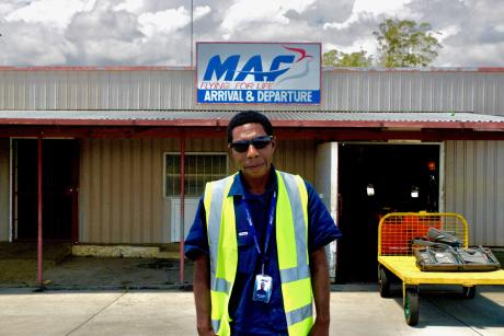 Kewa Imowa standing in front of the MAF Mount Hagen Base.