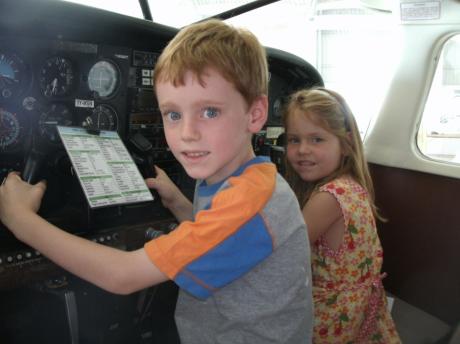 Mark and Anna Pearce in a cockpit
