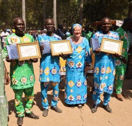 Translators with Bible & certificates